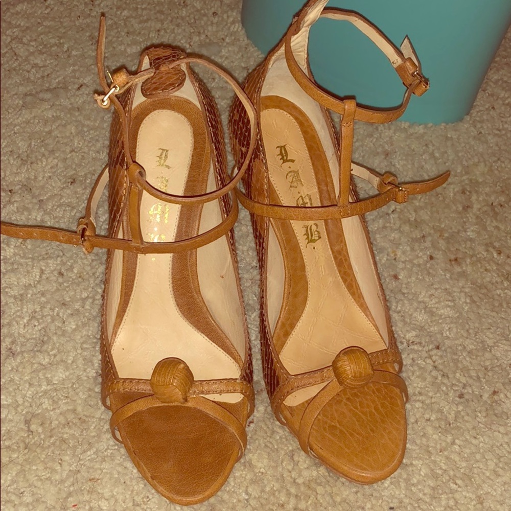 L.A.M.B brown snake skin Felix Sandles.
$.